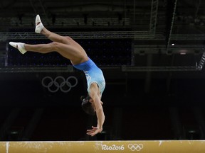 Gymnast Oksana Chusovitina from Uzbekistan trains on the balance beam ahead of the 2016 Summer Olympics in Rio de Janeiro.