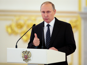 Russian President Vladimir Putin gives a speech during an awards ceremony for Russia's Olympians in Moscow's Kremlin on Aug. 25.