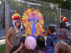 A teacher at École Lajoie wears indigenous headdress on Aug. 29, 2016.