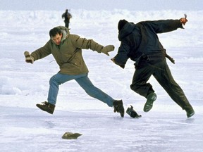 In this 1997 photo released by the International Fund for Animal Welfare, a seal hunter, right, threatens a cameraman with a knife during the filming of a seal hunt in the Gulf of St. Lawrence, Canada.