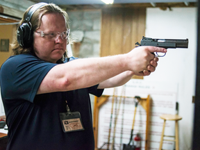 Chris Selley learns how to aim at the Georgetown Revolver Club.