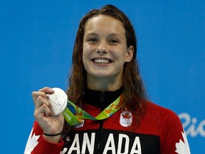 Silver medalist Penny Oleksiak of Canada beams on the podium during the medal ceremony for the women's 100m butterfly final on Day 2 of the Rio 2016 Olympic Games at the Olympic Aquatics Stadium on August 7, 2016.