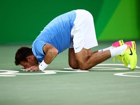 Juan Martin Del Potro of Argentina kisses the court after defeating Rafael Nadal of Spain in the men's singles semifinals on Day 8 of the 2016 Olympic Games at the Olympic Tennis Centre on Saturday, Aug. 13, 2016. Del Potro defeated Nadal 5-7, 6-4, 7-6 (5) and will meet Andy Murray in the final.