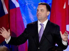 Ontario Progressive Conservative leader Tim Hudak announces that he will be stepping down as party leader after being defeated at his election night campaign head quarters in Grimsby, Ont., on Thursday, June 12, 2014. Hudak will resign his seat in the legislature next month and become CEO of the Ontario Real Estate Association.