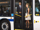 Prime Minister Justin Trudeau, left, and Ontario Premier Kathleen Wynne ride a city bus before making an announcement regarding new funding for transit in Barrie, Ont., on Tuesday, August 23, 2016.