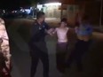 The video shows police stripping the boy of the suicide vest before taking him to a waiting vehicle.