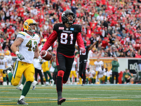 Calgary Stampeders receiver Bakari Grant celebrates as he runs in a touchdown in the second half of the CFL Labour Day Classic Calgary on Sept. 5.