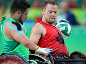 Canada's Zak Madell, right, spent time playing for the country's wheelchair basketball team. Now he's a member of the rugby side wearing the red maple leaf at the Rio Paralympics.