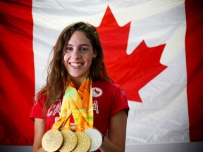 Aurelie Rivard poses with her four Paralympic medals — three gold and one silver — in Rio on Sept. 17.