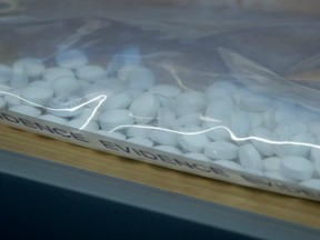 Fake Oxycontin pills containing fentanyl are displayed during a news conference at RCMP headquarters in Surrey, B.C. in 2015. Recently, Delta Police Chief Neil Dubord said first responders used the overdose-reversing drug naloxone to treat overdoses caused by cocaine laced with fentanyl.