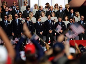 Ryan Moore, Phil Mickelson, Matt Kuchar, Brooks Koepka, Zach Johnson, Dustin Johnson, J.B. Holmes, Rickie Fowler and captain Davis Love III of the United States stand on stage during the 2016 Ryder Cup Opening Ceremony at Hazeltine National Golf Club on Sept. 29, 2016 in Chaska, Minnesota.