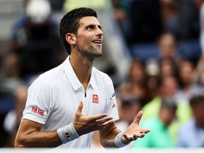 Novak Djokovic sends his heart to the crowd after defeating Gael Monfils 6-3, 6-2, 3-6, 6-2 in their men's semifinal on Friday, Sept. 9, 2016.