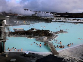 Bathers enjoy the warmth of the Blue Lagoon, just one of many thermal springs scattered across Iceland, including 15 pools in Reykjavik alone.