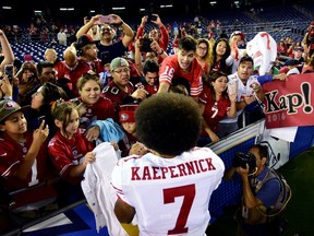 Colin Kaepernick signs autographs for fans after the San Francisco 49ers' Sept. 1, 2016 pre-season game against the San Diego Chargers.