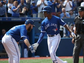 Melvin Upton Jr. (right) slaps hands with Russell Martin after hitting a two-run home run on Sept. 10.