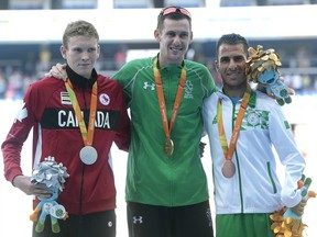 In this Sept. 11, 2016 file photo, silver-medallist Liam Stanley of Canada (left) poses on the men's 1,500-metre T37 podium with gold-medallist Michael McKillop (centre) and bronze-medallist Madjid Djemai at the Rio Paralympics.
