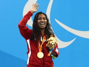 Gold medallist Katarina Roxon of Canada celebrates on the podium at the medal ceremony for the women's SB8 100-metre breaststroke at the Rio 2016 Paralympics on Wednesday.
