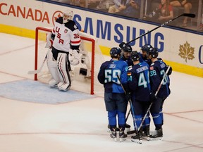 Team Europe celebrates a goal in front of U.S. goaltender Jonathan Quick during their 3-0 win on Sept. 17.