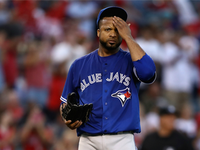 Blue Jays starter Francisco Liriano mops his brow after giving up a home run to Los Angeles' Albert Pujols in the second inning on Sept. 17.
