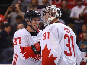 Sidney Crosby (left) congratulates goaltender Carey Price after Canada's win over Europe on Sept. 21.