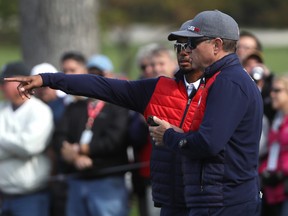 Captain Davis Love III and vice-captain Tiger Woods of the United States discuss the course prior to the 2016 Ryder Cup at Hazeltine National Golf Club on September 27, 2016 in Chaska, Minnesota.