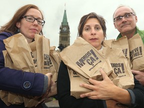 Activists, including some from the charity Canada Without Poverty, hold a demonstration on Parliament Hill in 2015.