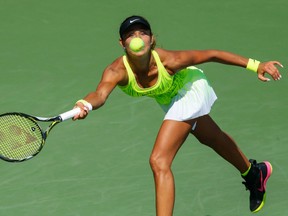 Vitalia Diatchenko of Russia hits a return to Timea Bacsinszky of Switzerland during their first-round U.S. Open match on Aug. 30.