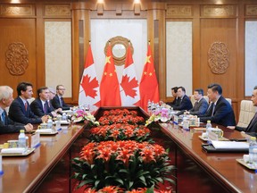 Chinese President Xi Jinping (2nd R) and Justin Trudeau