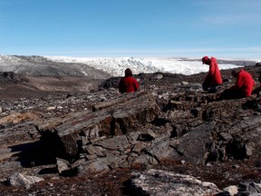 Vickie Bennett, Allen Nutman and Clark Friend examining rocks in Greenland, where 3.7 billion year old stromatolite fossils were found