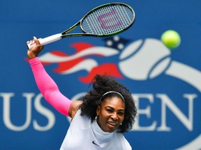 Serena Williams of the U.S. hits a return to Johanna Larsson of Sweden during their U.S. Open women's singles match at the USTA Billie Jean King National Tennis Center in New York on Saturday.