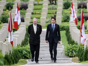 Justin Trudeau  walks with British historian Tony Banham through the Sai Wan War Cemetery during his visit to Hong Kong on September 6, 2016.