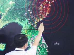 A South Korean official points locates the epicenter of seismic waves in North Korea, at the Korea Meteorological Administration in Seoul on September 9, 2016 following news of another nuclear test by North Korea.
