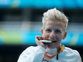 In this Sept. 10, 2016 file photo, Belgium's Marieke Vervoort reacts on the podium after receiving the silver medal for the women's 400m (T52) at the Rio Paralympics.