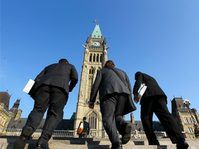 Workers climbs the stairs towards Parliament Hill Ottawa Monday Sept 17, 2012. The fall session starts today