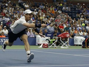 Andy Murray of the United Kingdom returns a shot to Spain's Marcel Granollers during second-round action at the U.S. Open Thursday in New York. Murray won the match in straight sets, 6-4, 6-1 and 6-4.
