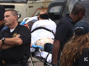 Ahmad Khan Rahami is taken into custody after a shootout with police Monday, Sept. 19, 2016, in Linden, N.J