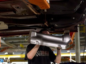 An assembly line worker at the General Motors assembly plant in Oshawa, Ont.