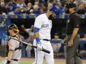 Jose Bautista is the picture of dejection after striking out during Thursday's MLB game against the Baltimore Orioles at Rogers Centre. Baustista struck out three times as the Jays lost 4-0 to the Baltimore Orioles. The victory moved the Orioles into a tie with the Jays for the first wild-card spot in the American League. Toronto finishes up its regular season schedule in Boston with three games against the division-winning Red Sox.
