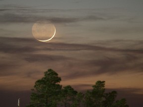 A rare "black moon" rises over the Western Hemisphere on Friday, Sept. 30, 2016. A black moon is the second new moon in a calendar month.