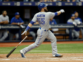 Toronto Blue Jays' Russell Martin watches his two-run home run off Tampa Bay Rays relief pitcher Kevin Jepsen during the eighth inning of Toronto's 5-3 win on Sept. 4.
