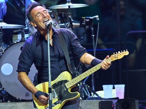 Bruce Springsteen and Max Weinberg, back, perform with the E Street Band at Madison Square Garden, Wednesday, Jan. 27, 2016, in New York.