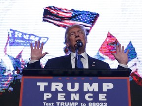 In this Sept. 16, 2016, photo, Republican presidential candidate Donald Trump speaks during a campaign rally at the James L. Knight Center in Miami.