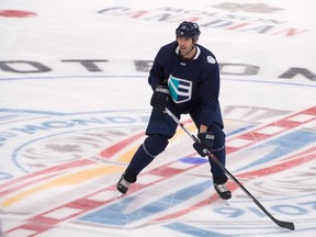Team Europe's Zdeno Chara skates by the World Cup logo during a practice session in Quebec City on Sept. 5.