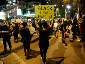 Protesters take to the streets during a peaceful march following Tuesday's police shooting of Keith Lamont Scott in Charlotte, N.C., Thursday, Sept. 22, 2016.