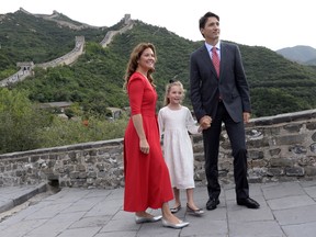 Justin Trudeau, his wife Sophie Gregoire, and daughter Ella-Grace pose for a photo atop a section of the Great Wall of China, in Beijing on Thursday, September 1, 2016.