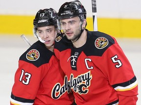 Calgary's Johnny Gaudreau (left) and Mark Giordano celebrate a goal during a Dec. 27, 2015 game against the Edmonton Oilers.