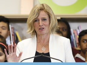 Alberta Premier Rachel Notley speaks a school opening September 1. She has accepted Wildrose Leader Brian Jean's apology for making a joke about physically beating her.