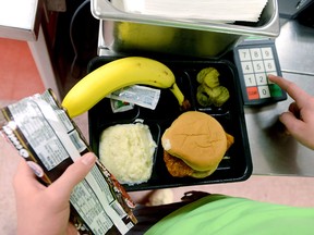 A student pays for his school lunch in a file photo