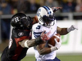 Ottawa Redblacks' Damaso Munoz (45) reaches to tackle Toronto Argonauts' Brandon Whitaker during second half CFL action on Friday.