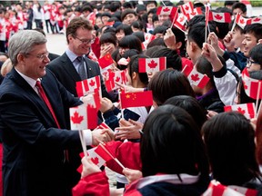 Mark Rowswell, known as Dashan in China, with Stephen Harper during his visit to China in 2012.